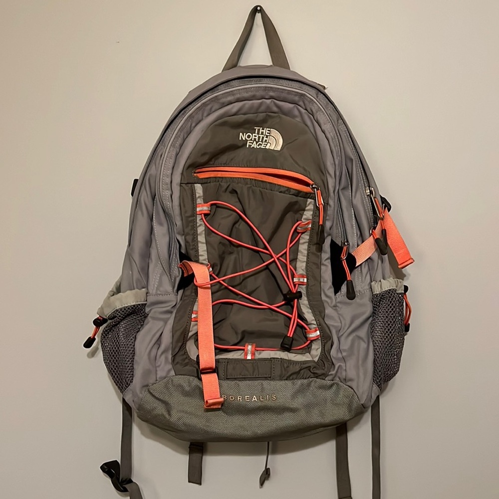 Gray and Orange North Face Backpack